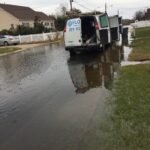 FloodCo van parked at residential site flooded due to a pipe burst