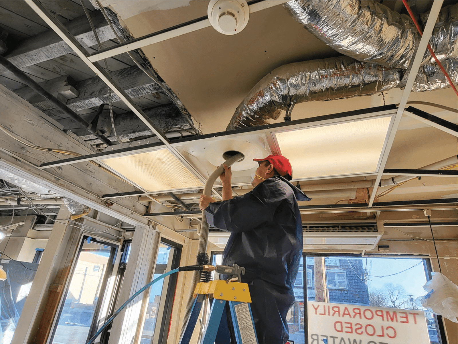 Professional technician performing duct cleaning service, using specialized equipment to remove dust, debris, and allergens for improved air quality and HVAC efficiency