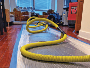 FloodCo's hardwood floor drying mats at work