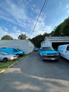 newly wrapped flooco vans parked by the company's warehouse