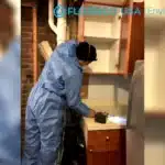 basement mold inspection and removal being performed by floodco technician.