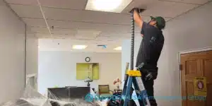 FloodCo technician performing duct cleaning job