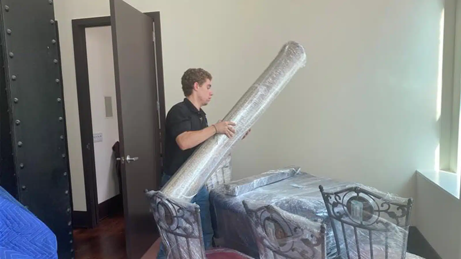 contents storage service being performed by FloodCo USA Technician to secure belongings while water remediation job is done.