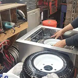Initial cleaning of wheels in a flooded shop in New Jersey.