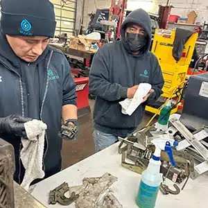 Final stages of cleaning service in a New Jersey mechanical shop.