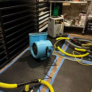 drying equipment set up to dry floors from water damage.