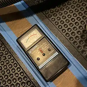 Moisture meter on green to show that the area is now dry.